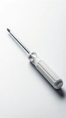Fototapeta premium White-handled screwdriver with chrome shaft placed on clean neutral background. Concept of minimalism and precision in tools