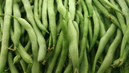 A Close-Up View of Fresh Green Beans Ready for Harvest or Cooking, Vibrant Green Vegetables Displayed in Abundance