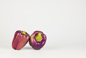 Diverse and colorful variety of bell peppers found naturally in the regions of Peru displayed on a white background