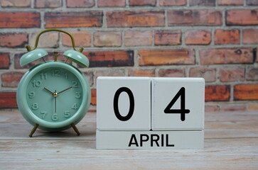 Wooden Calendar Showing the Date of April 4th. Day 4 of April month