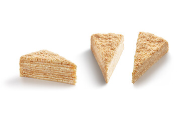 Three slices of fresh tasty Napoleon cake isolated on white background