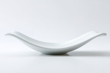 Elegant white ceramic bowl with a unique curved design suitable for modern dining decor and food presentation