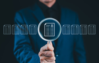 Resume Screening and Candidate Evaluation Concept. Businessman holding magnifying glass on resume icons, recruitment, candidate screening, human resources, employee evaluation, HR document analysis,