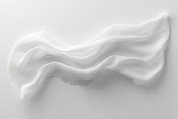 Fototapeta premium Flowing white fabric gracefully draped on a light background creating an elegant and serene atmosphere