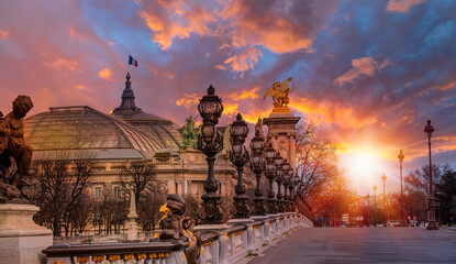 Alexandre III Bridge with Roof of the Grand Palais in the background at sunset - Paris, France