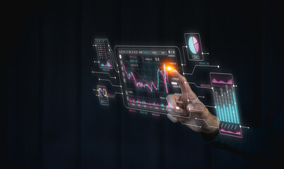 A person interacts with a holographic interface displaying financial data, charts, and analytics in...