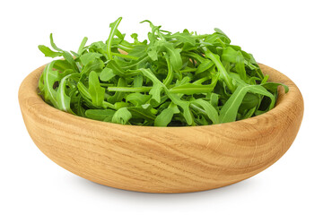 Heap of green fresh rucola or arugula leaf in wooden bowl isolated on white background