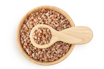 Boiled buckwheat in a wooden bowl isolated on white background. Top view. Flat lay