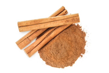 Cinnamon sticks and powder isolated on white background. Top view. Flat lay