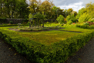 Dunvegan Castle overlooks the Isle of Skye’s coast, surrounded by manicured gardens, exotic...