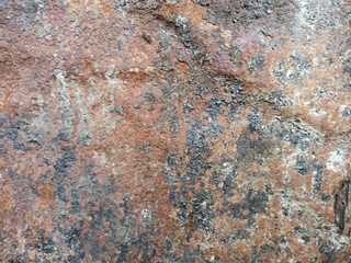 Rusty Corroded Metal Surface Close-Up. Detailed texture of a rusty, oxidized metal surface with...