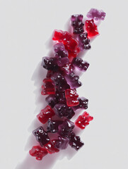 Falling Purple Gummy Bears Against Neutral Background