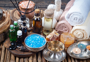 Spa massage items are arranged in a composition on the table.