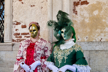 Venice, Italy - People dressed in carnival masks are photographed by tourists in the scenery of the...