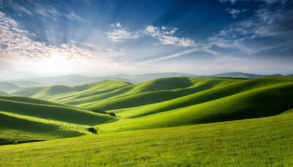 Green rolling landscape over sunny sky
