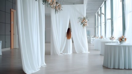 A serene and sophisticated wedding venue filled with soft ethereal details like flowing curtains delicate floral arrangements and a warm romantic atmosphere