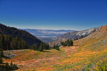 Box Elder Peak hiking views from trail, American Fork Canyon. Lone Peak, Mt Timpanogos, Wasatch Range Rocky Mountains, Utah, United States.