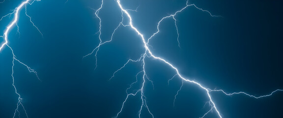 lightning bolt strikes across a dark blue sky