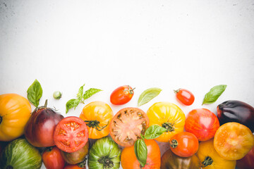 Mixed tomatoes top view. Composition with variety of colorful fresh organic tomatoes.