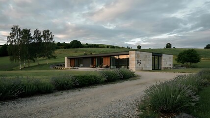 Obraz premium Modern countryside house with large glass windows surrounded by golden wheat field and open sky