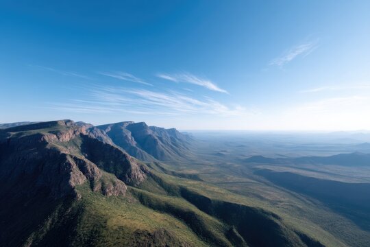 aerial view of rugged south african landscape with vast open plains and mountain ranges emphasizing natural serenity