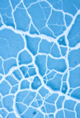 close up of a blue and white surface