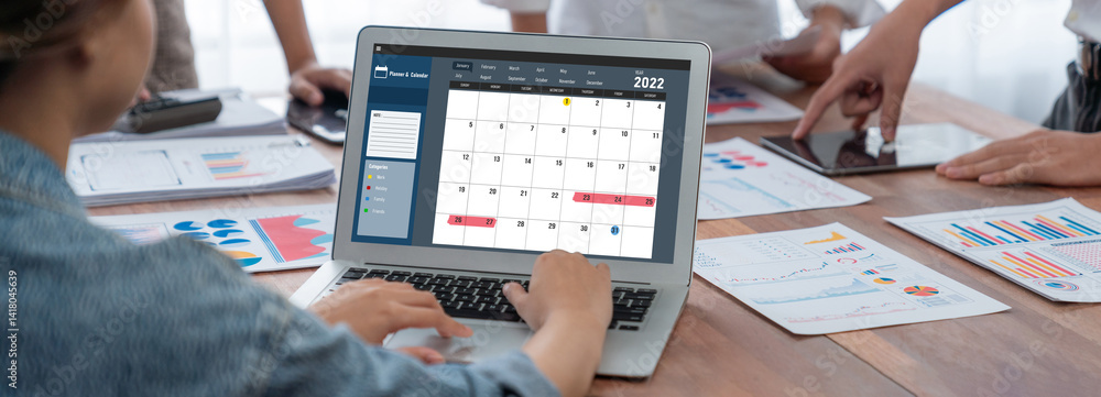 Poster calendar on computer software application for brisk schedule planning for personal organizer and onl