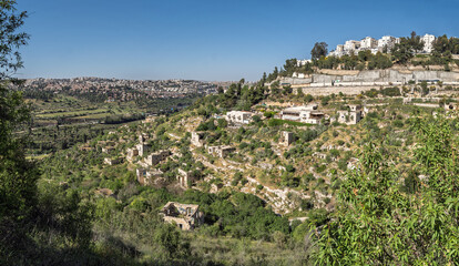 Ruined houses of an ancient arabian abandoned village Lifta located on hills near Jerusalem, Israel. Panoramic view.