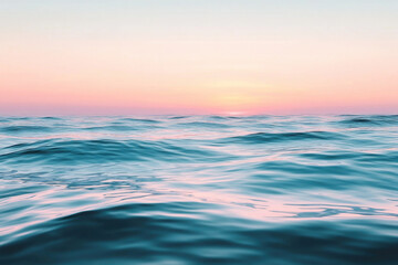 Obraz premium Sunset over ocean waves, a serene and colorful horizon blending into the water, creating a peaceful maritime scene.