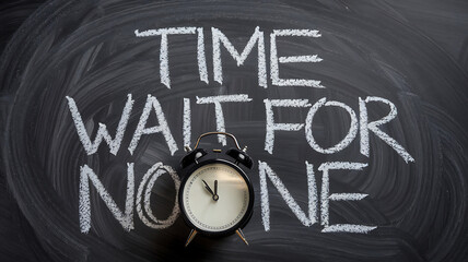 Chalkboard with Time Waits For No One and a small black alarm clock at the bottom.