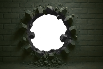 Breaking Through: A powerful image of a brick wall with a large hole punched through it, symbolizing overcoming obstacles and achieving breakthrough.  
