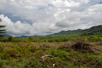 Cloudy evening at a picturesque mountain resort in autumn, heavy thunderclouds. Early autumn, picturesque mountain ranges.