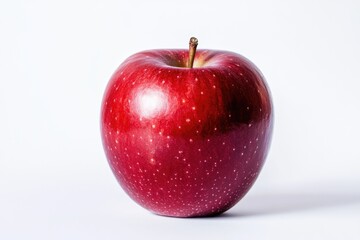 A single, ripe red apple sits on a white background, showcasing its vibrant color and smooth skin.