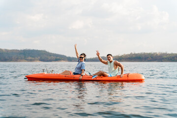 Adventurous latin hispanic friends kayaking across a tranquil lake, soaking in the warmth of a...