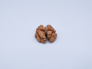 Opened half of a walnut, on a white background, close-up