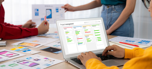 Project planning software for brisk business project management on the computer screen showing...