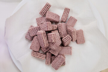 Purple waffles on a white napkin
