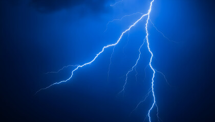 lightning bolt striking through a dark blue sky