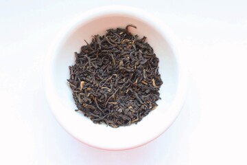 black tea leaves on white background