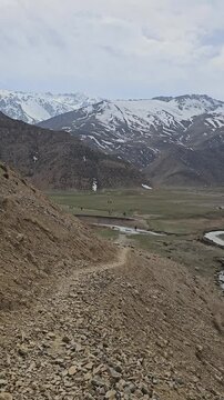 Mountain with green ground and river