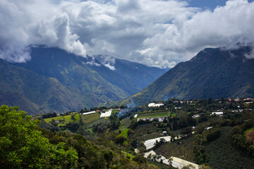 A panoramic view of a small town nestled on a mountain slope, Ecuador. 