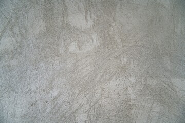 The photograph showcases an abstract wall texture in shades of gray with subtle patterns, offering an elegant and professional appearance. Perfect as a background for presentations, design projects