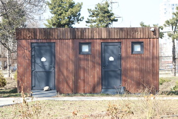 A Rustic Outdoor Restroom Building Designed for Use in a Park Setting, Enhancing Visitor Experience