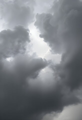 plane flying through a cloudy sky on a cloudy day