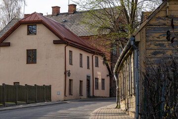 Quiet Street in a Historic European Town with Old Wooden and Stone Buildings at Sunset Light. 18.04.2025. Cesis. Latvia.