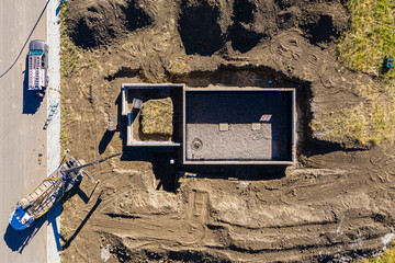 Construction site with a crane and a dump truck