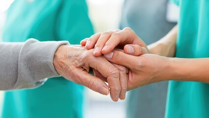 A female nurse caregiver holds hands to encourage and comfort an elderly woman. For care and trust in nursing homes for people of retirement age Caregiver helping elderly woman provides medical advice