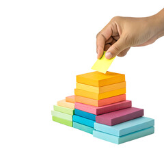 Hand Placing a Yellow Sticky Note on a Stack of Colorful Sticky Notes Isolated on Transparent Background