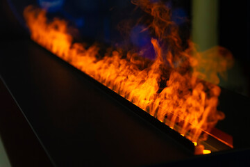 Bright fire burns in a fireplace