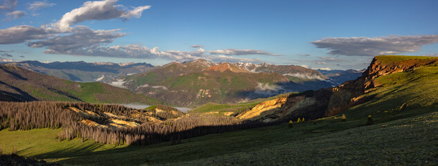 The suns first light illuminates the yellow soil of the Slumgullion Earthflow, a 700 year old...